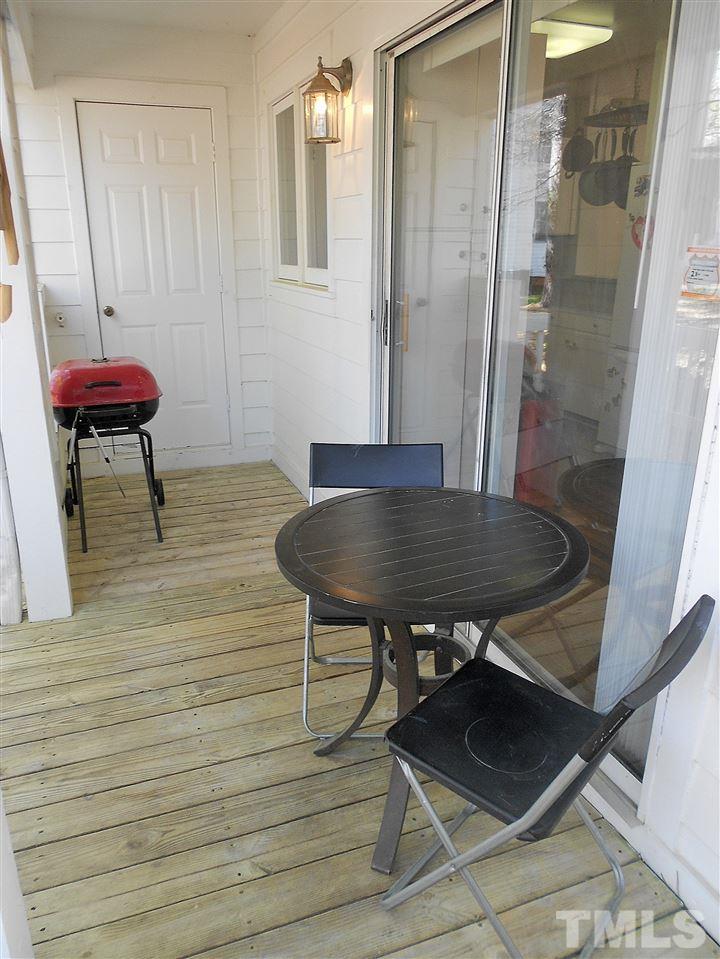3823 Carnegie Lane Raleigh, NC 27612 - Photo 22 of 25 a view of a room with a table and a chair