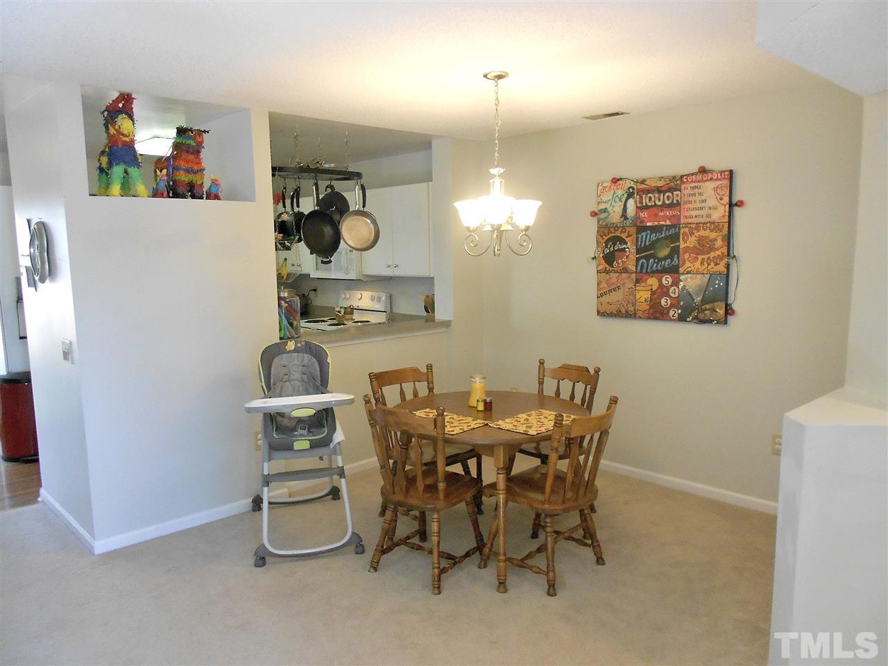 3823 Carnegie Lane Raleigh, NC 27612 - Photo 5 of 25 a view of a dining room with furniture