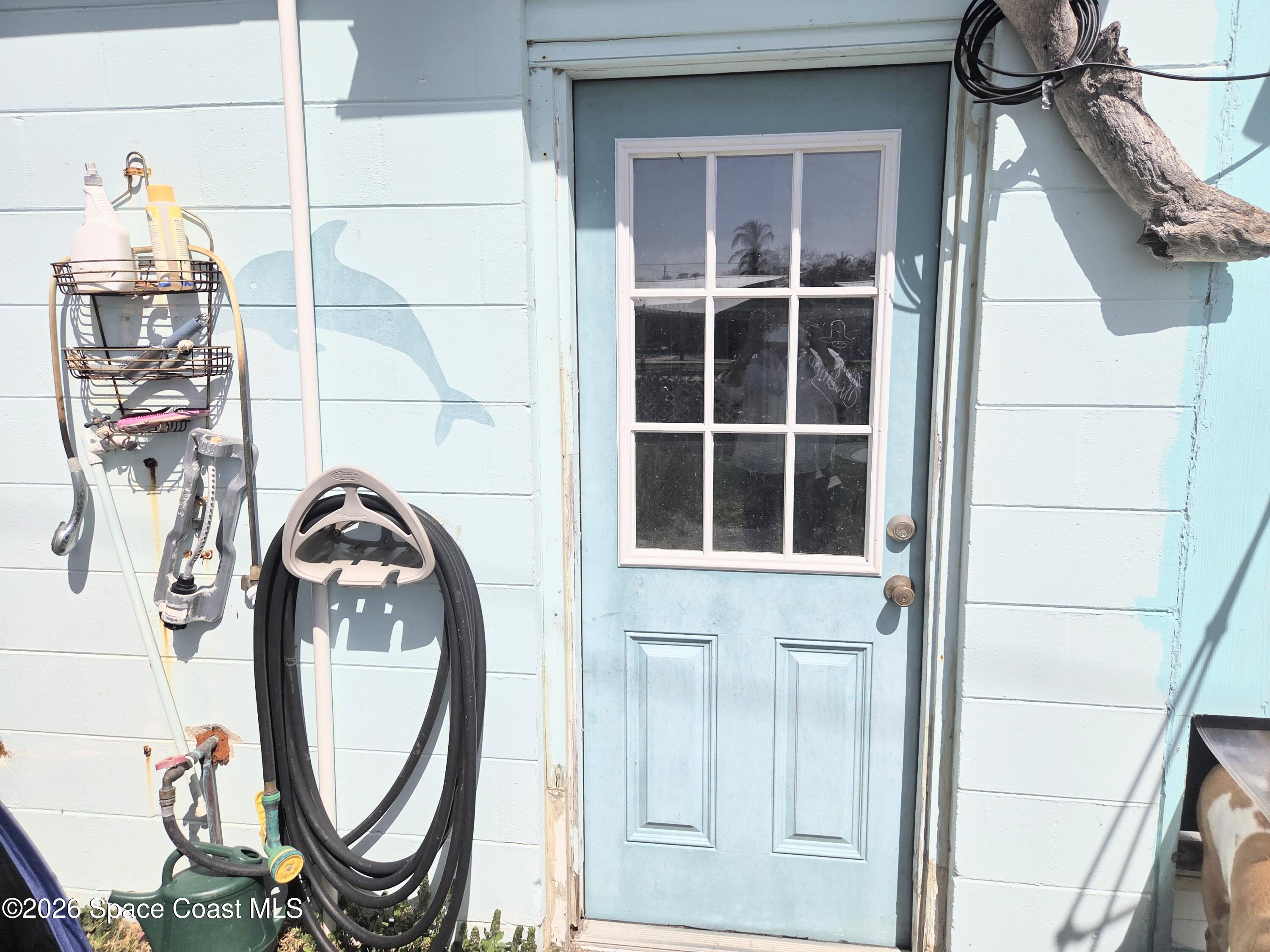 416 North 4th Street Cocoa Beach, FL 32931 - Photo 21 of 22 back door from garage