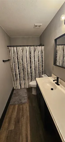a bathroom with a sink and a large window