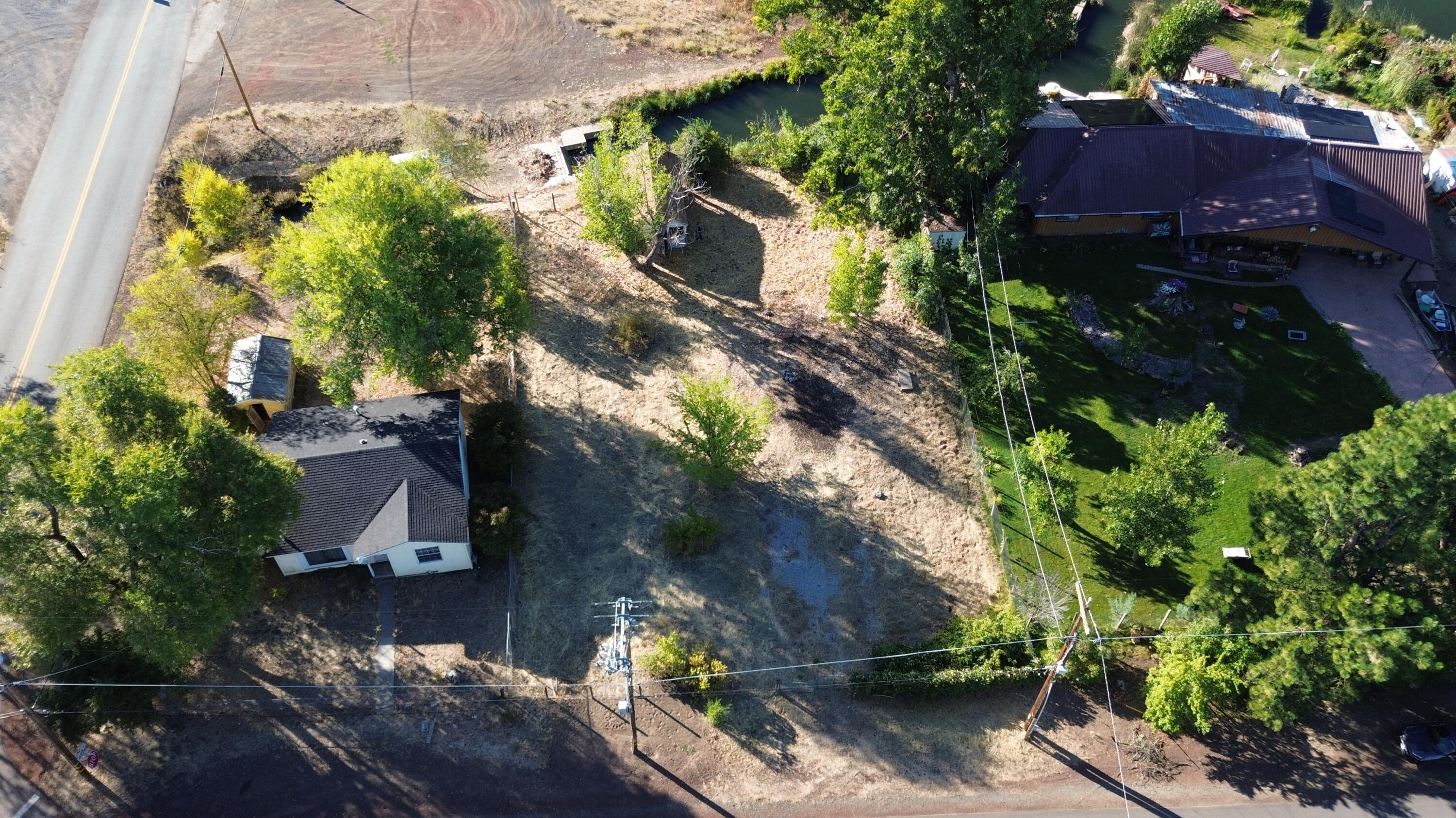 43195 Bridge Street Fall River Mills, CA 96028 - Photo 16 of 20 an aerial view of a house with a yard