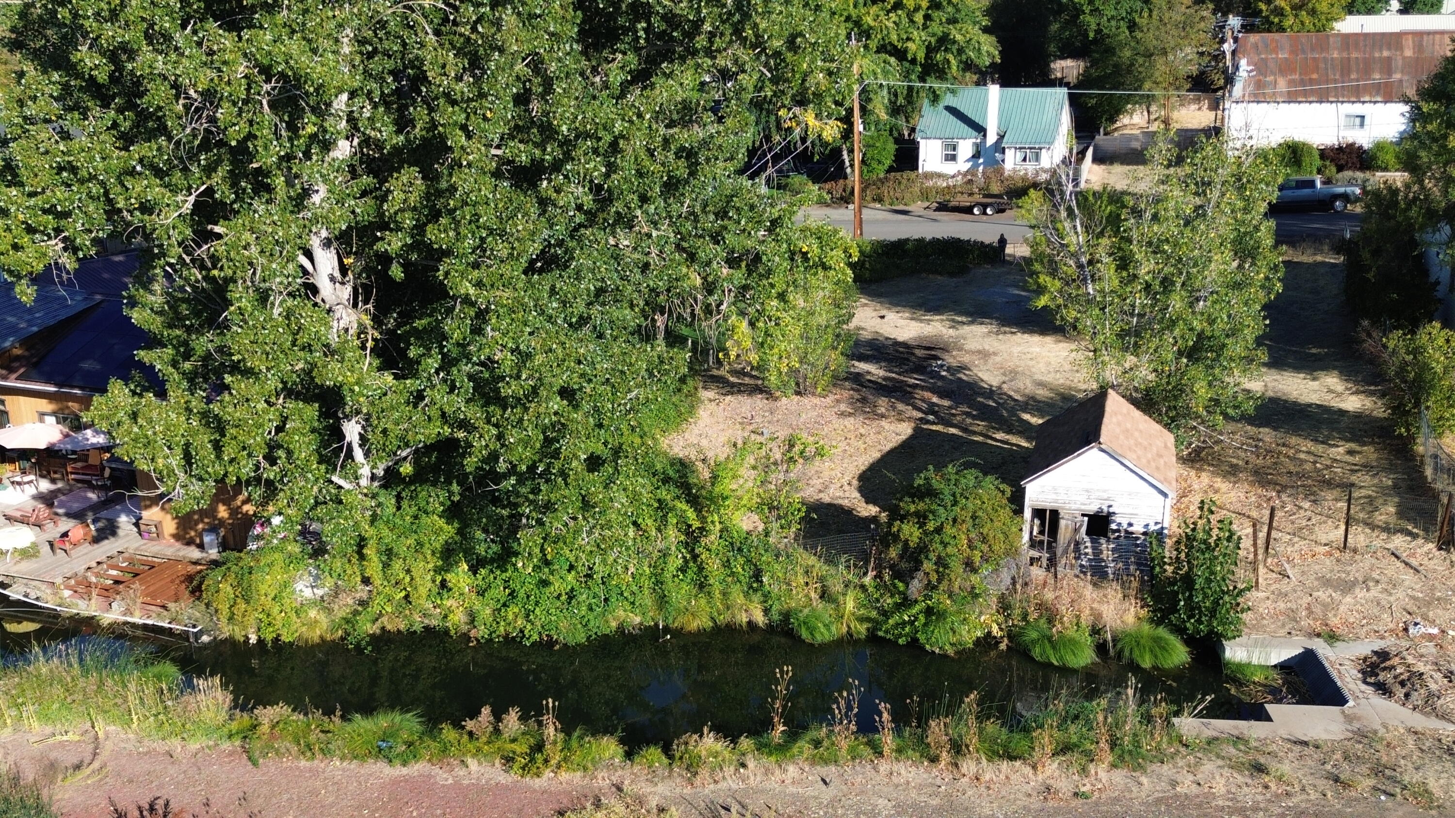 43195 Bridge Street Fall River Mills, CA 96028 - Photo 5 of 20 an aerial view of residential house with outdoor space and lake view