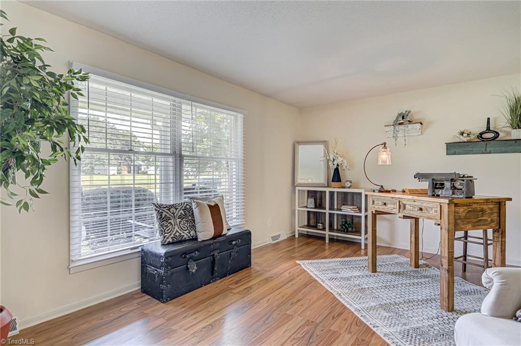 2606 Maxine Drive High Point, NC 27265 - Photo 4 of 34 Wonderful living room with laminate floors, located beside foyer. Currently shown as a home-office.