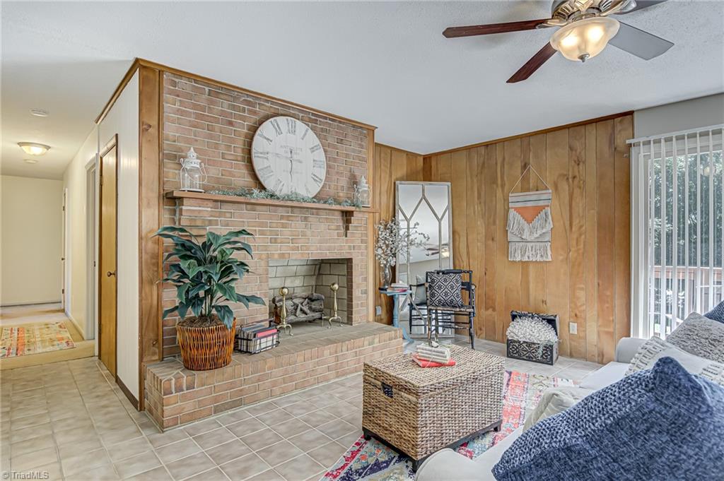 2606 Maxine Drive High Point, NC 27265 - Photo 6 of 34 Spacious den also boasts fireplace! Hallway to the left leads to three bedrooms.