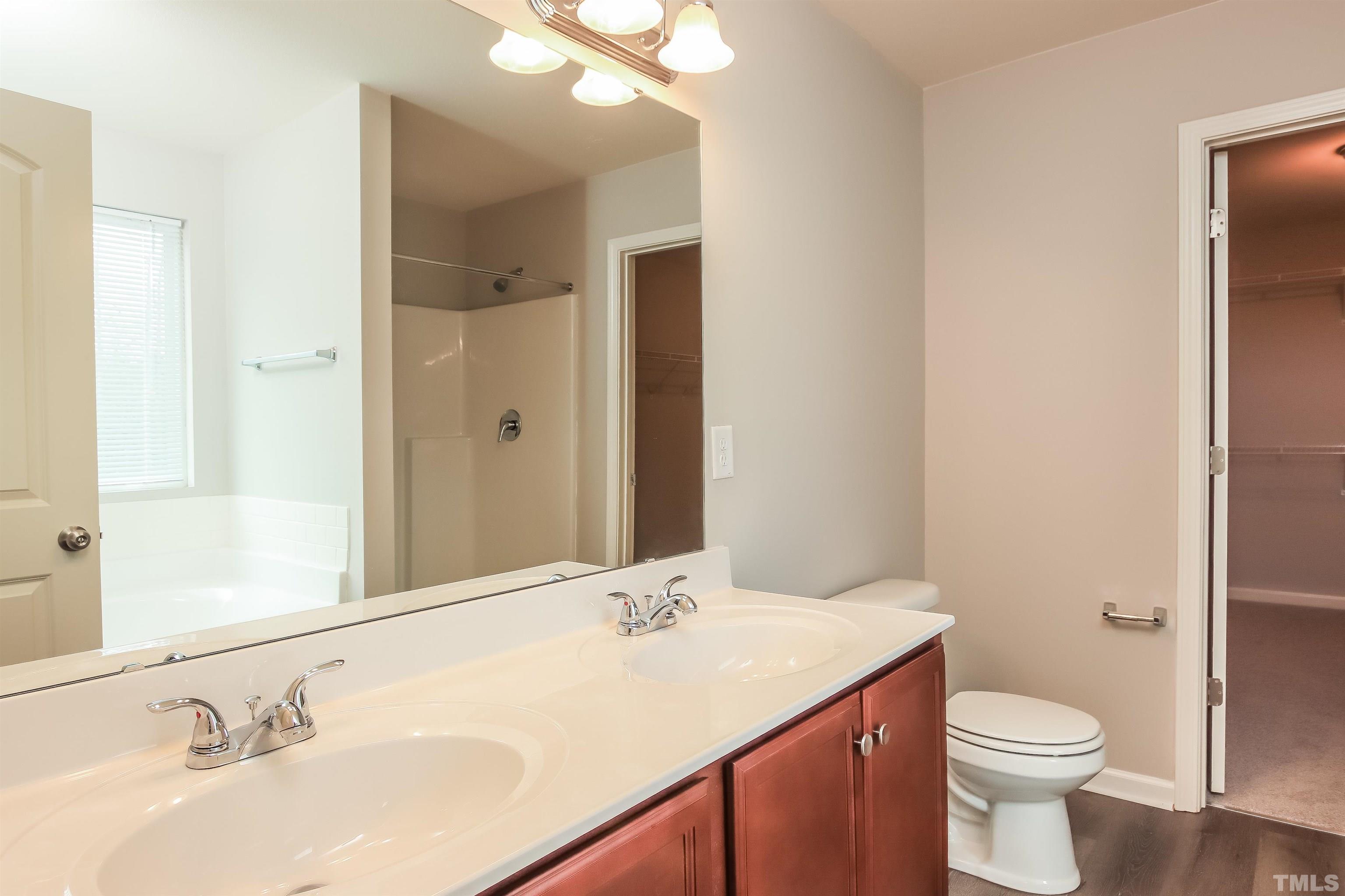 333 Sequoia Drive Clayton, NC 27527 - Photo 13 of 17 a bathroom with a sink and a mirror
