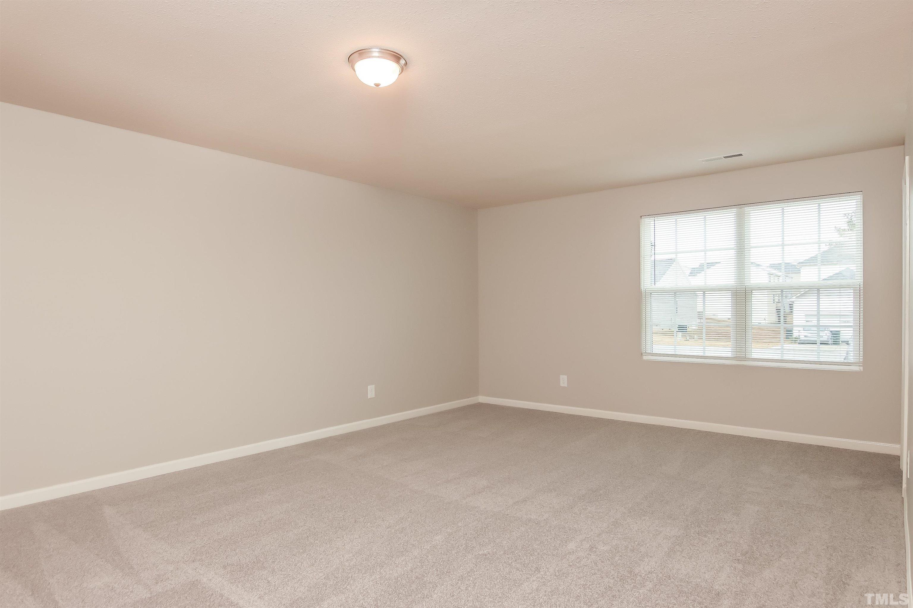 333 Sequoia Drive Clayton, NC 27527 - Photo 14 of 17 an empty room with a window
