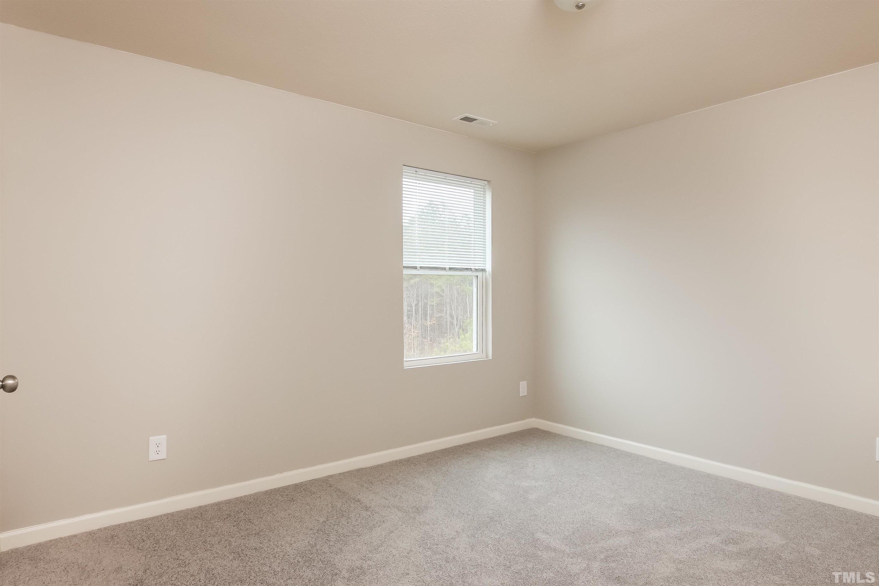 333 Sequoia Drive Clayton, NC 27527 - Photo 15 of 17 an empty room with a window