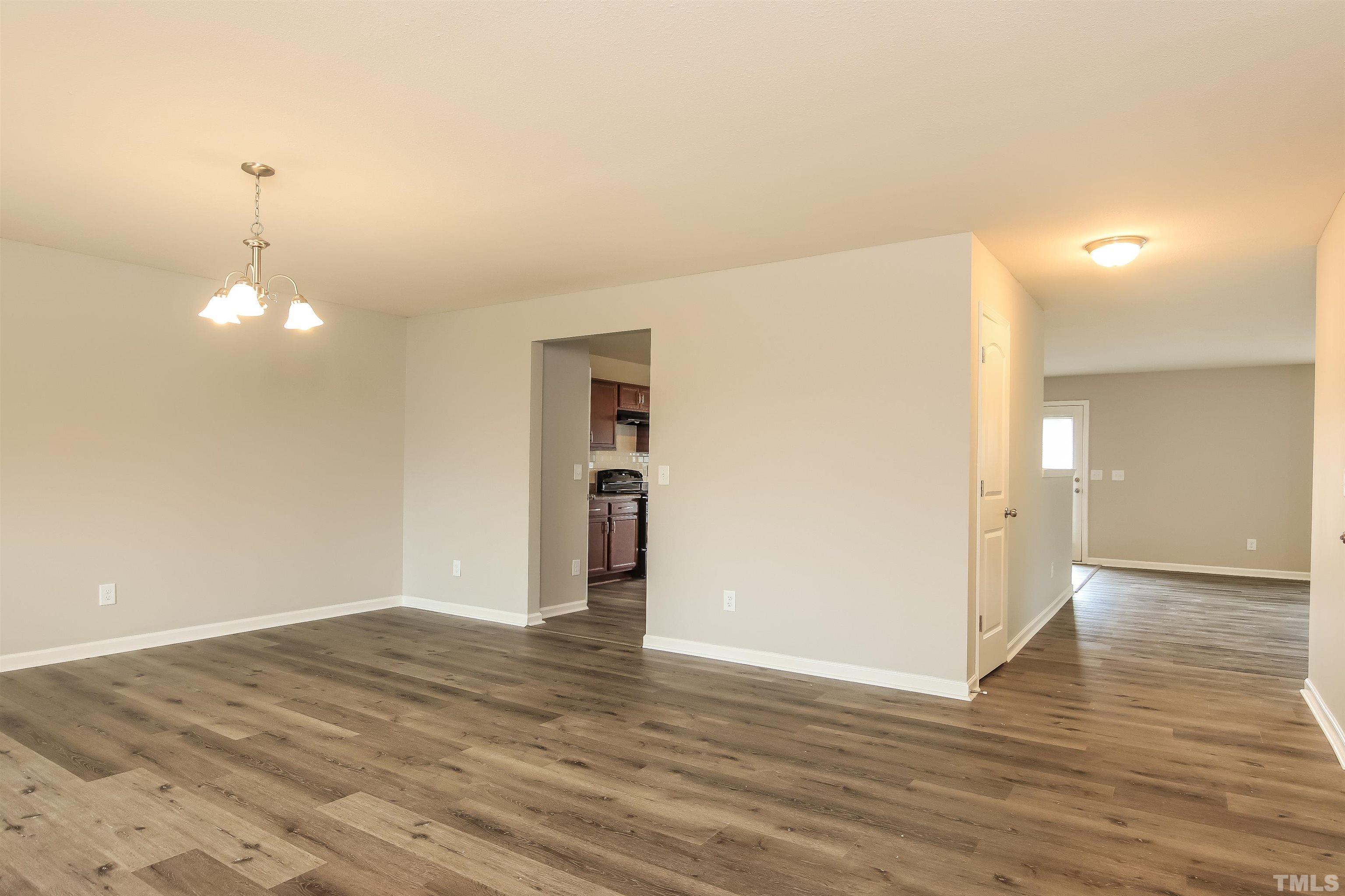 333 Sequoia Drive Clayton, NC 27527 - Photo 4 of 17 a view of empty room with wooden floor