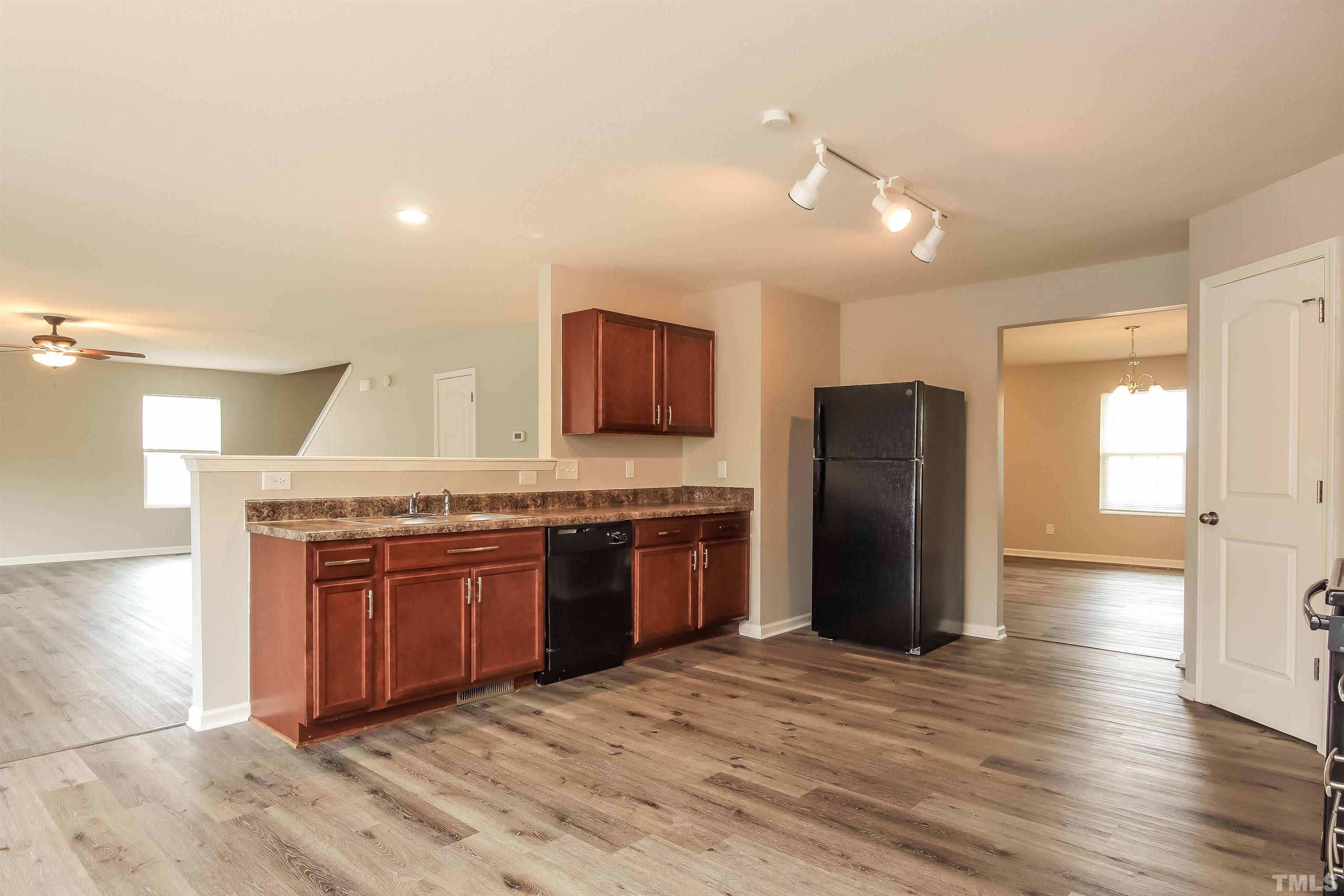 333 Sequoia Drive Clayton, NC 27527 - Photo 8 of 17 a large kitchen with stainless steel appliances granite countertop a stove and a refrigerator