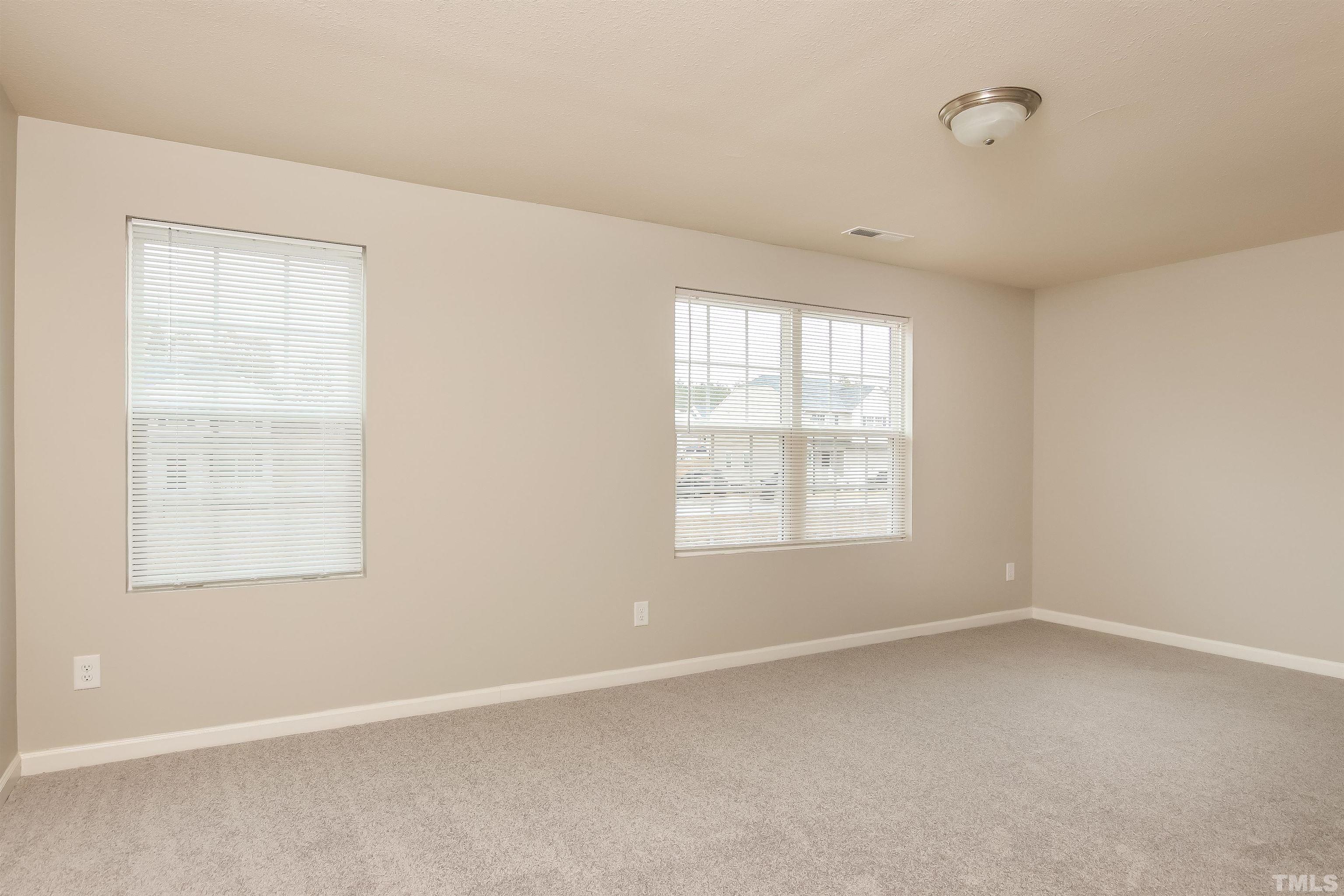 333 Sequoia Drive Clayton, NC 27527 - Photo 10 of 17 an empty room with a window