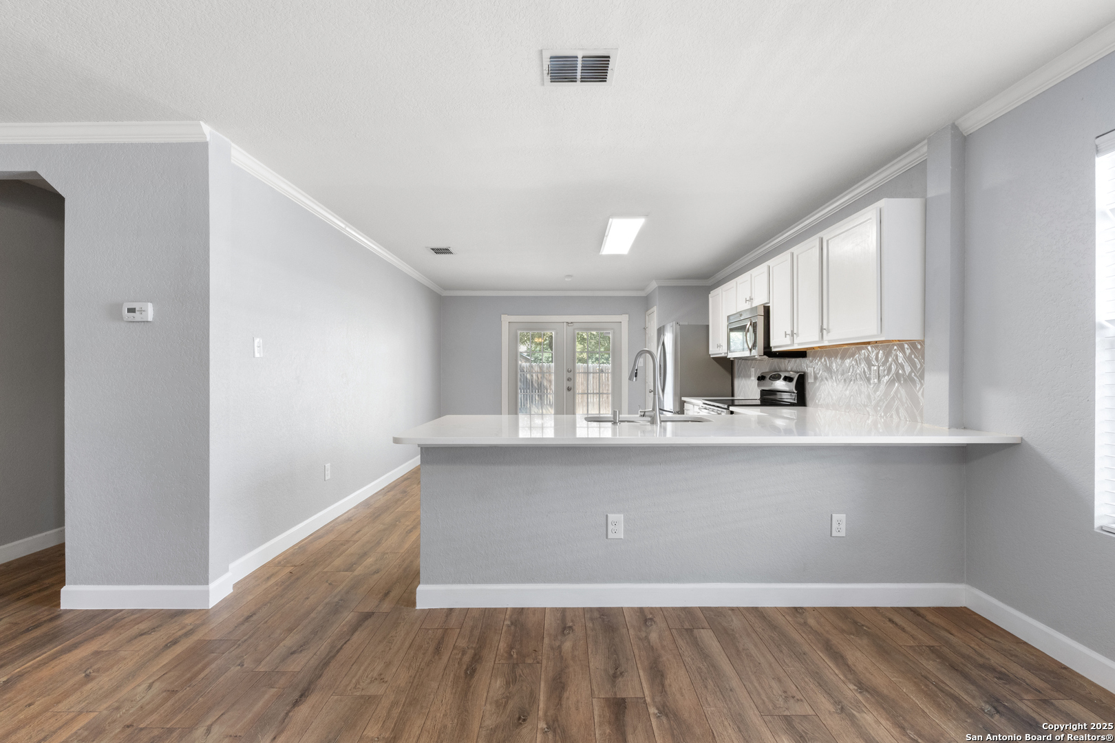 8119 Running Hollow Selma, TX 78154 - Photo 11 of 33 a view of kitchen with wooden floor and window