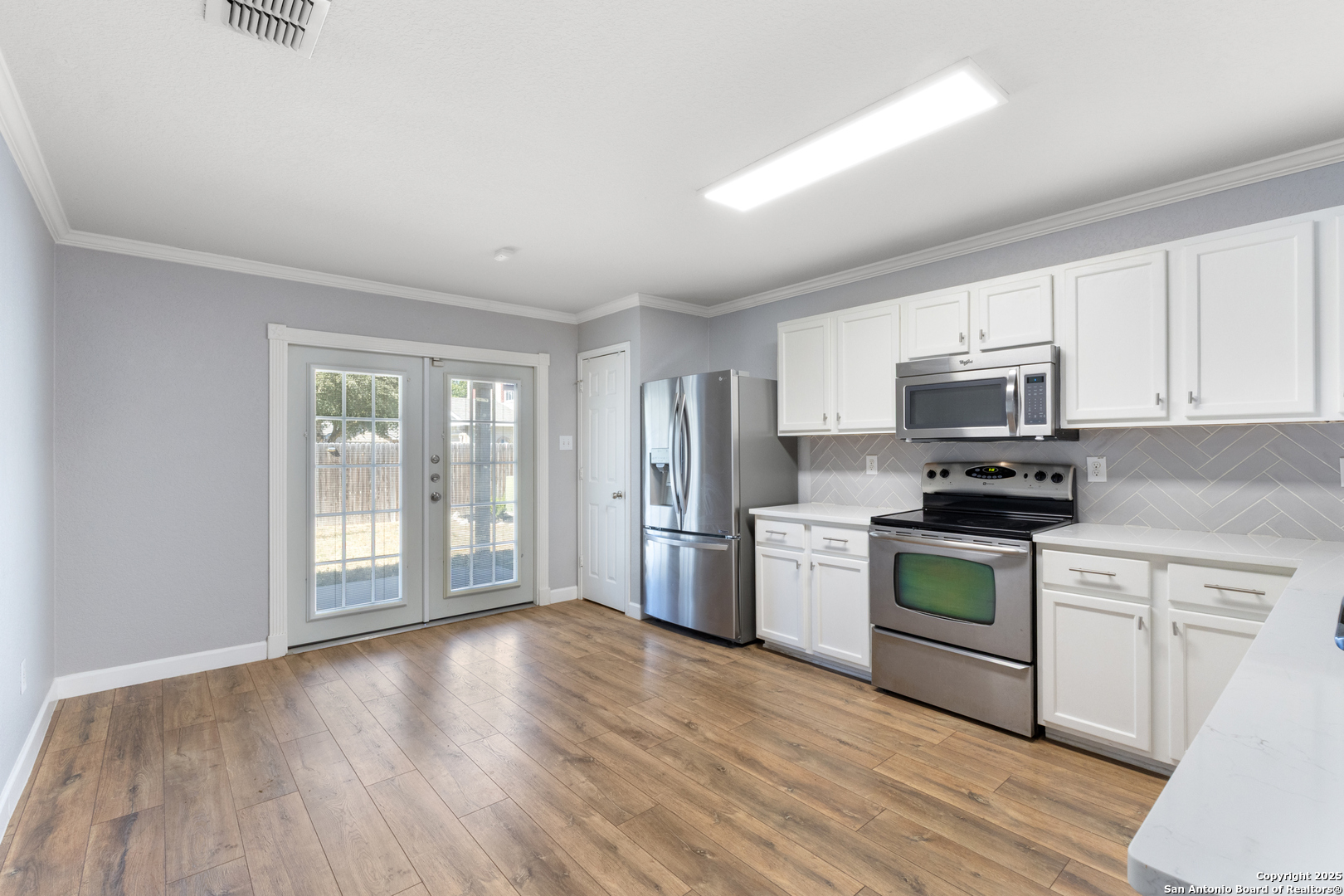 8119 Running Hollow Selma, TX 78154 - Photo 12 of 33 a kitchen with a refrigerator stove top oven and sink