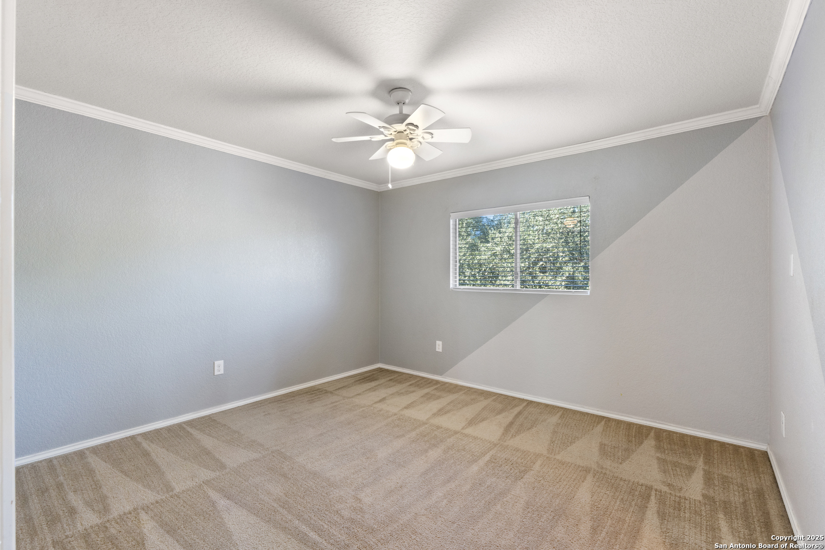 8119 Running Hollow Selma, TX 78154 - Photo 21 of 33 an empty room with windows and fan