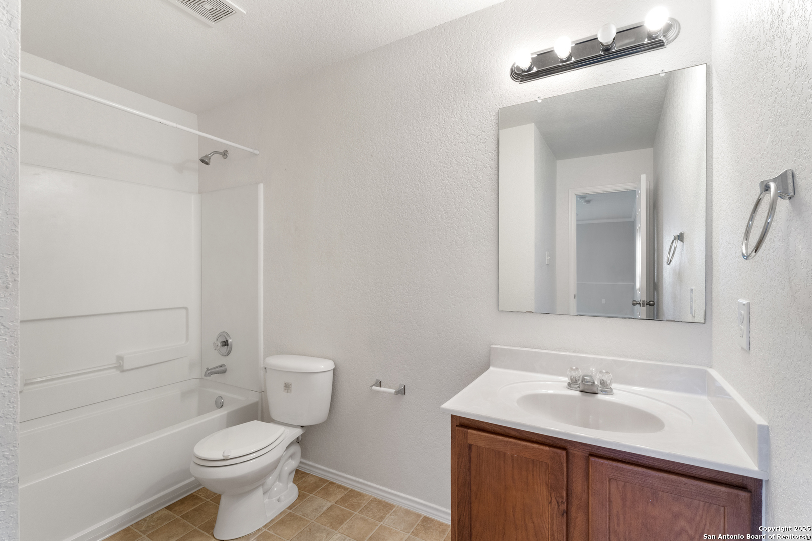 8119 Running Hollow Selma, TX 78154 - Photo 22 of 33 a bathroom with a sink toilet vanity and shower