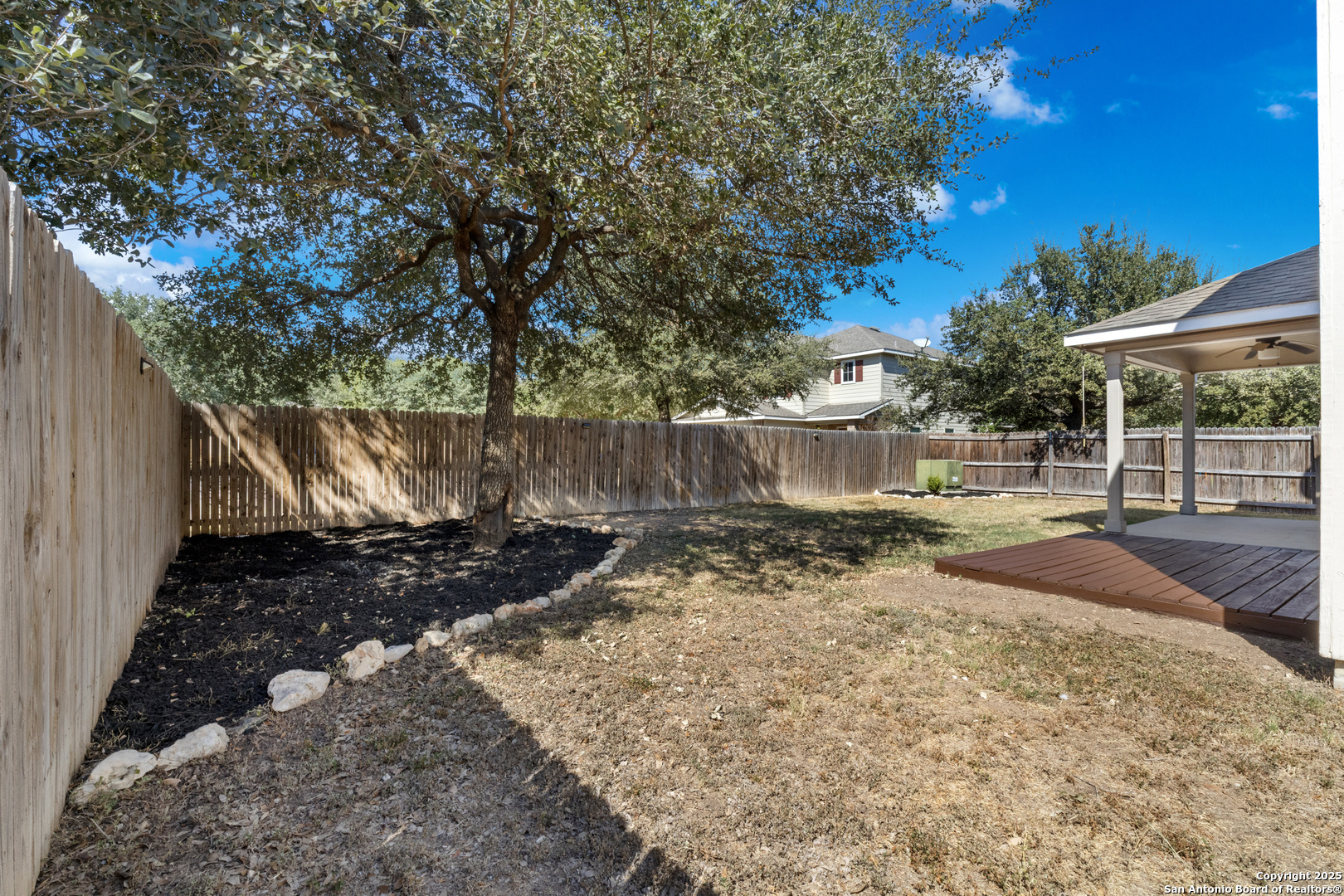 8119 Running Hollow Selma, TX 78154 - Photo 28 of 33 a view of a backyard with large trees and a barn