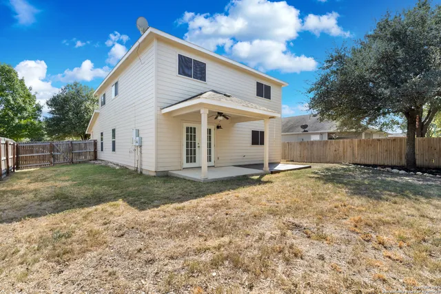 an aerial view of a house with outdoor space