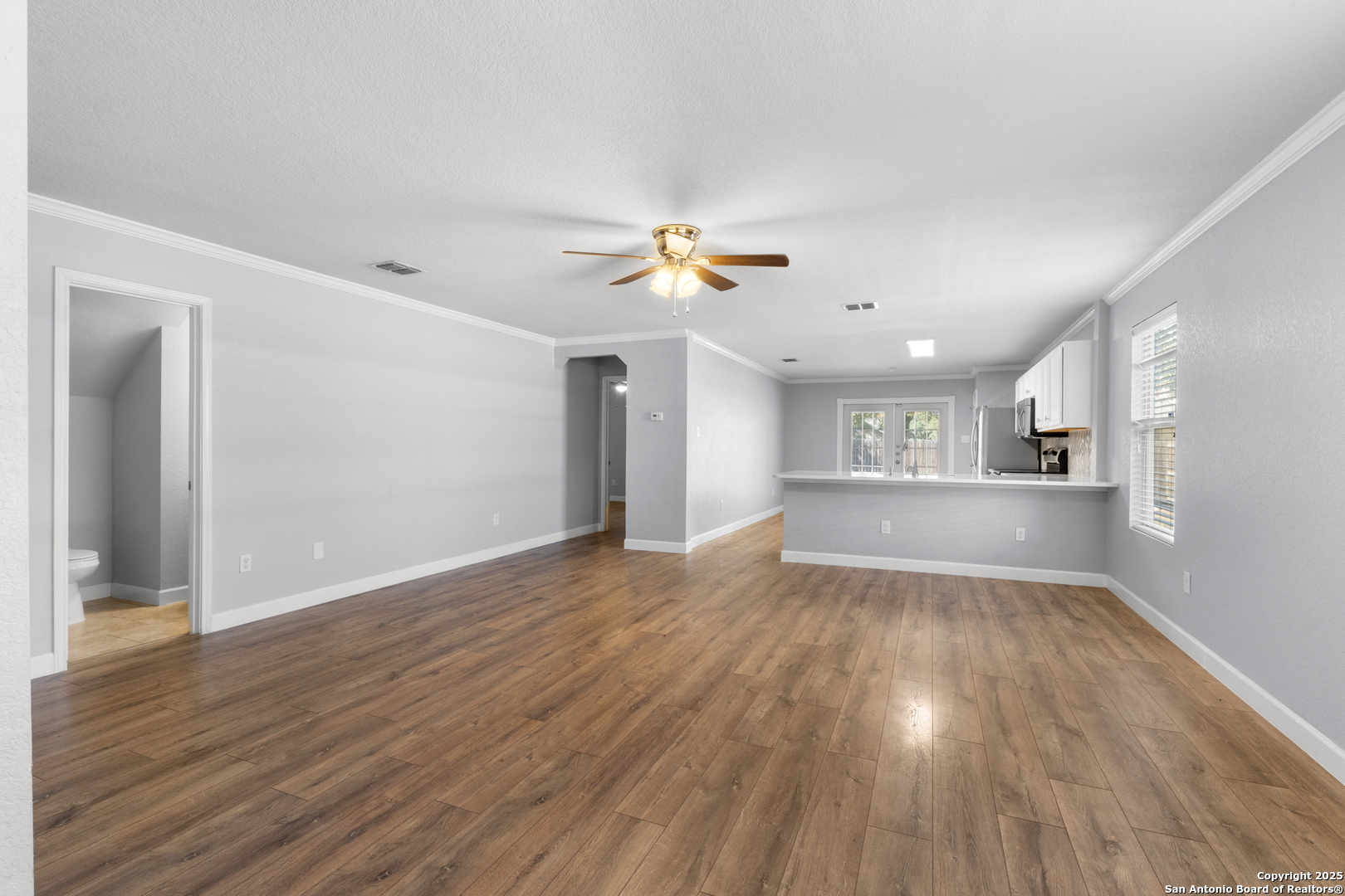 8119 Running Hollow Selma, TX 78154 - Photo 8 of 33 a view of a kitchen with wooden floor and a kitchen space with a sink