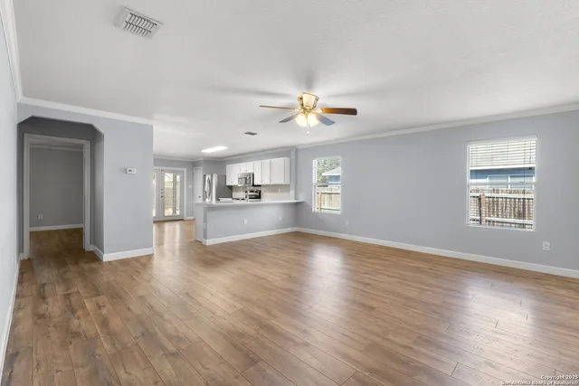 a view of an empty room with a window