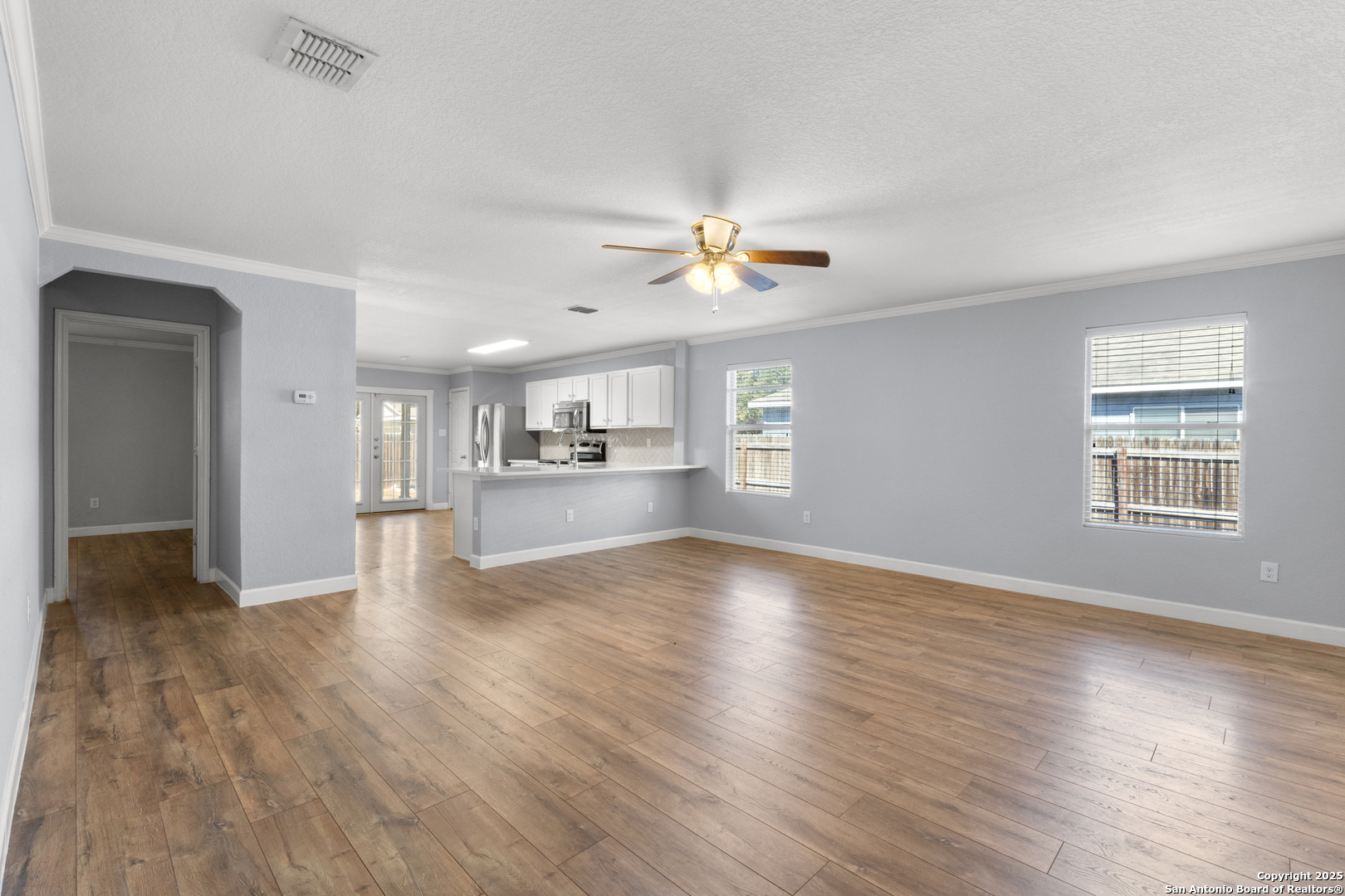 8119 Running Hollow Selma, TX 78154 - Photo 9 of 33 a view of an empty room with kitchen and window