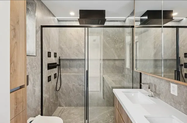 a bathroom with a sink and shower