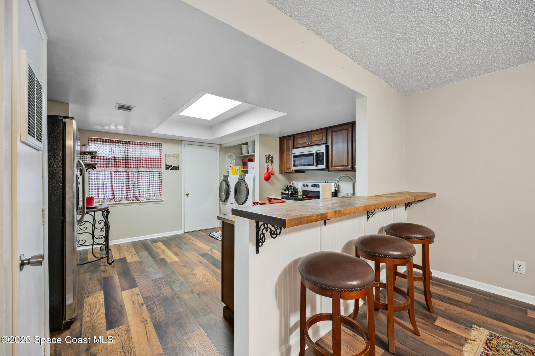 1515 Huntington Lane, Unit 227 Rockledge, FL 32955 - Photo 5 of 14 a view of a kitchen and dining room