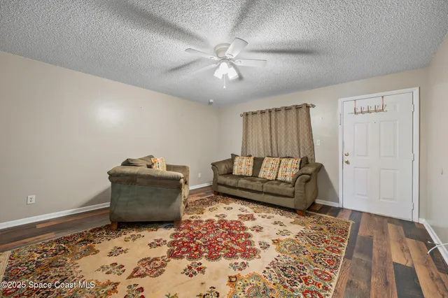 a living room with furniture and a rug