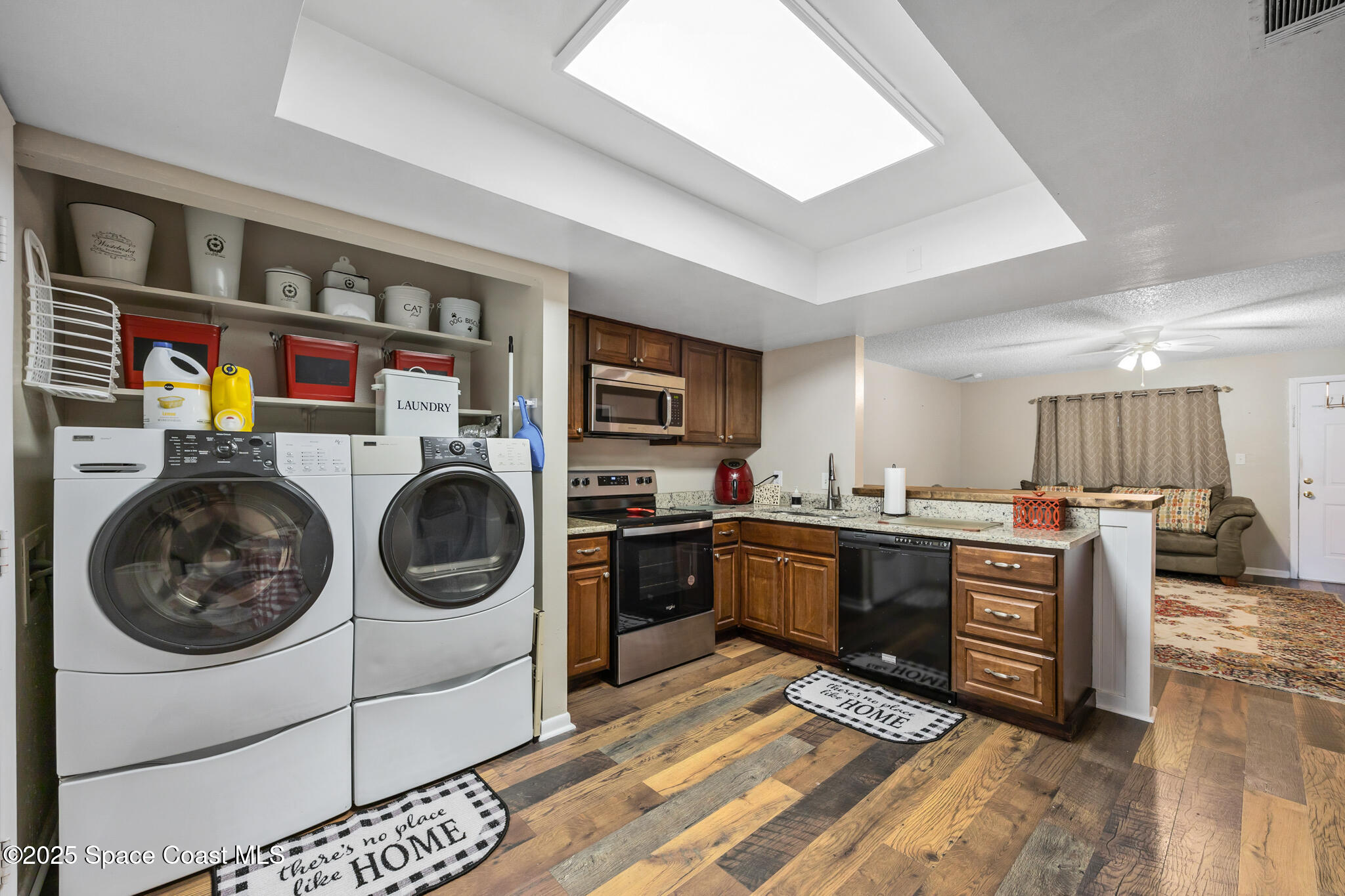 1515 Huntington Lane, Unit 227 Rockledge, FL 32955 - Photo 8 of 14 a kitchen with a stove top oven and cabinets