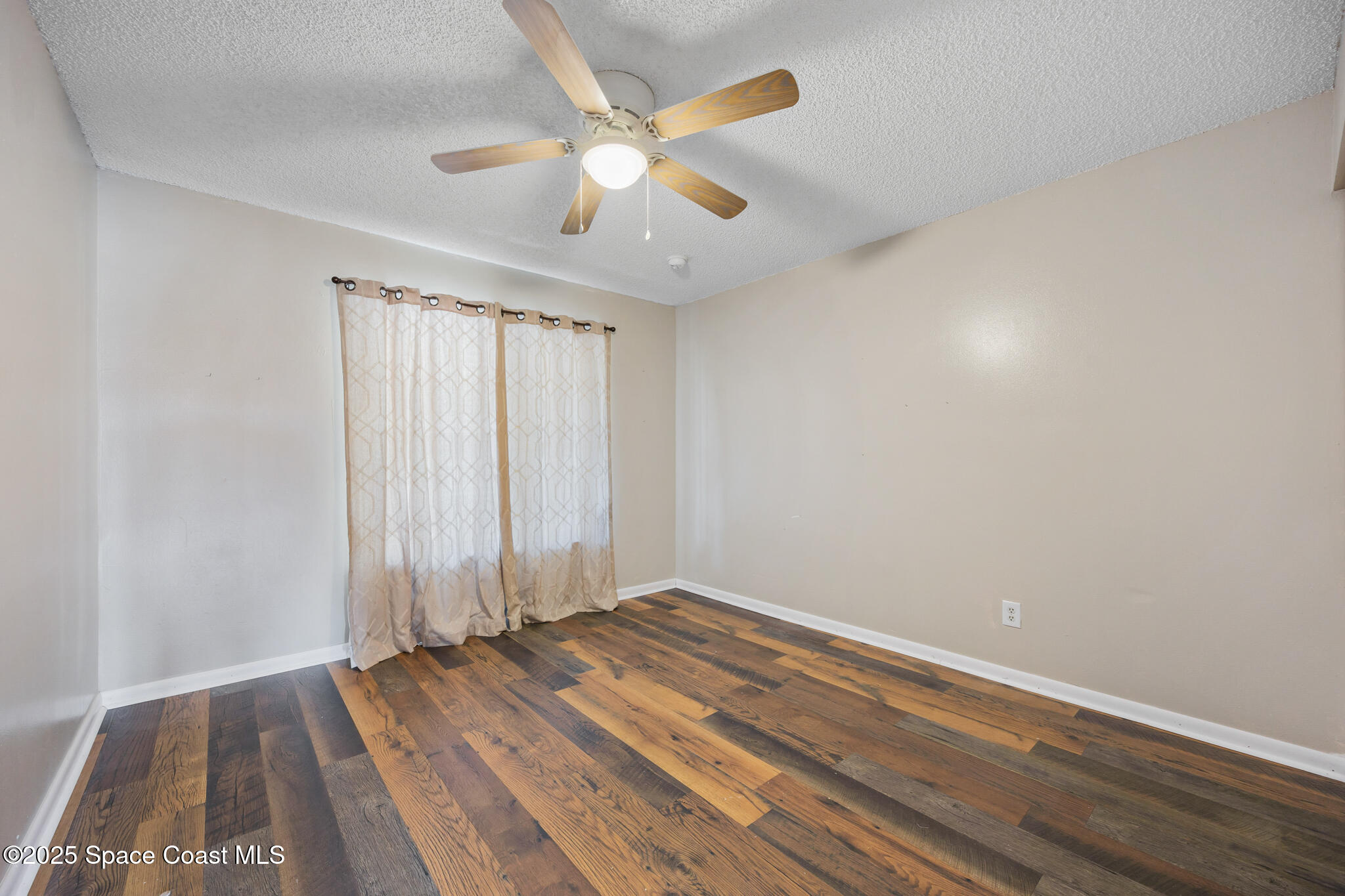 1515 Huntington Lane, Unit 227 Rockledge, FL 32955 - Photo 9 of 14 a view of room with window and ceiling fan