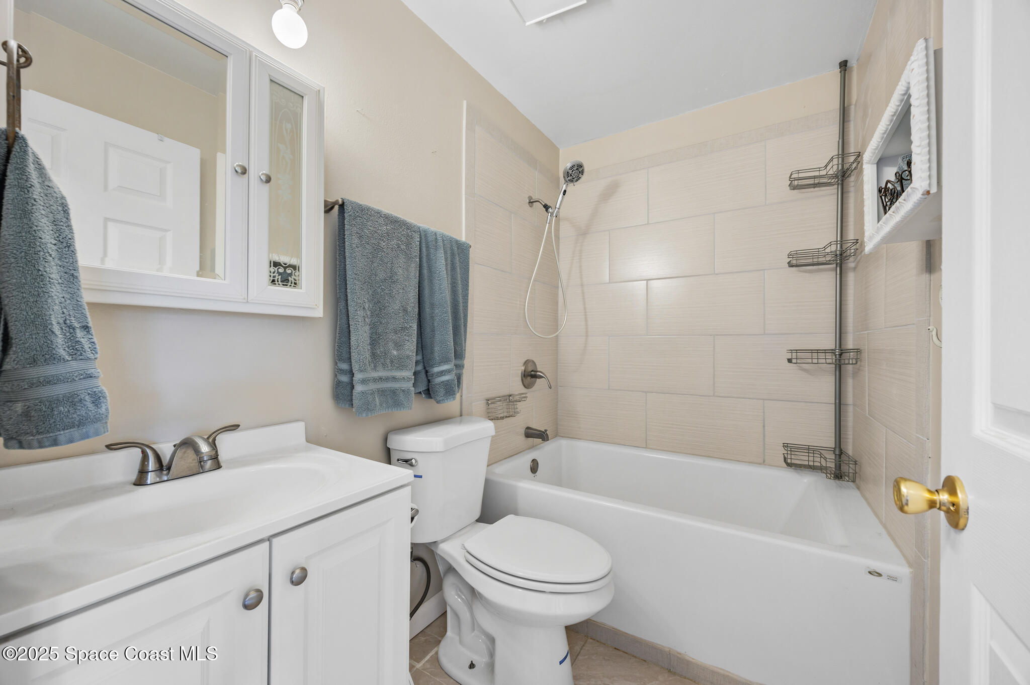 1515 Huntington Lane, Unit 227 Rockledge, FL 32955 - Photo 10 of 14 a bathroom with a sink toilet and shower