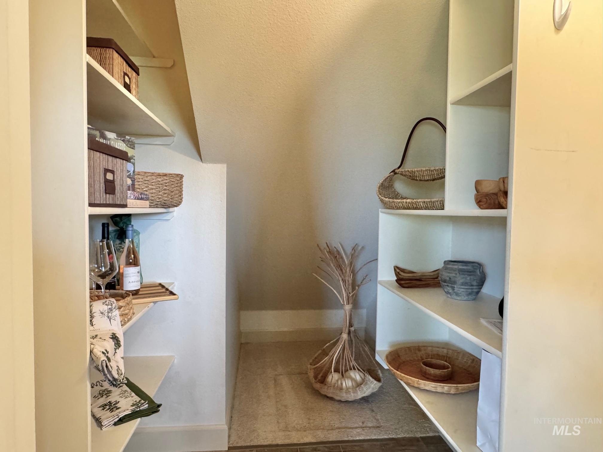 9299 Kemp Road Middleton, ID 83644 - Photo 15 of 50 Recessed alcove storage featuring multiple built-in shelving units
