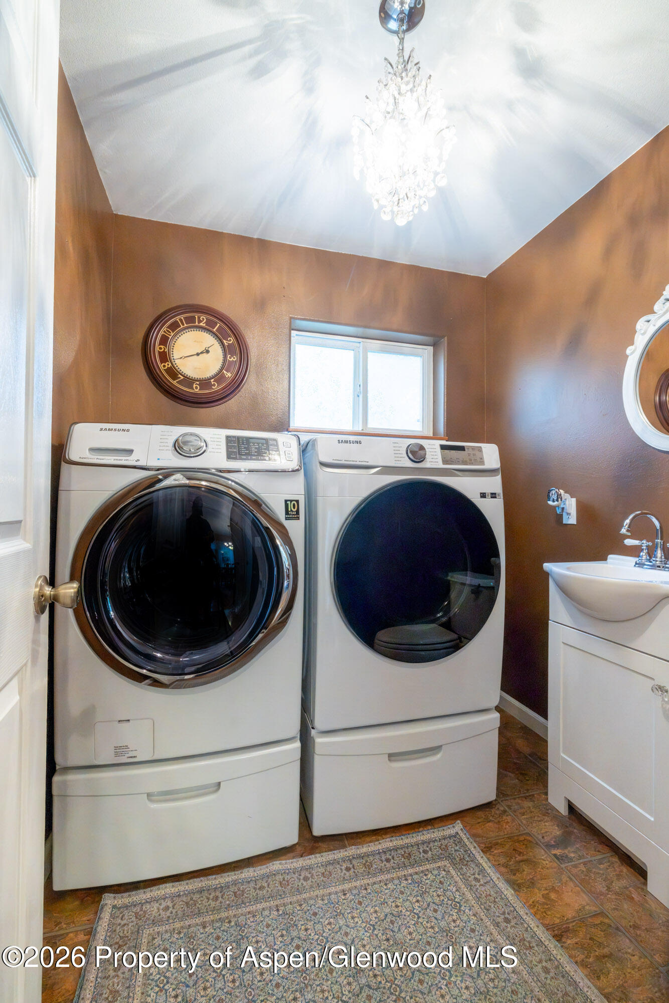 1335 Firethorn Drive Rifle, CO 81650 - Photo 18 of 30 a utility room with dryer and washer