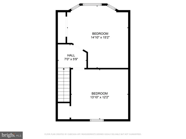 a picture of a bench in front of a wall