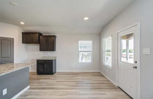 a view of living room with furniture and fireplace
