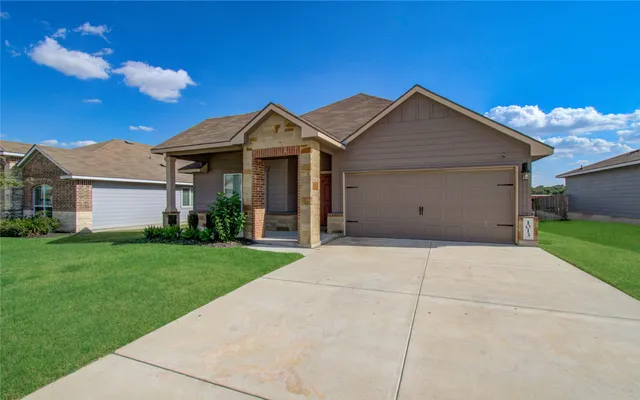 a view of garage and yard