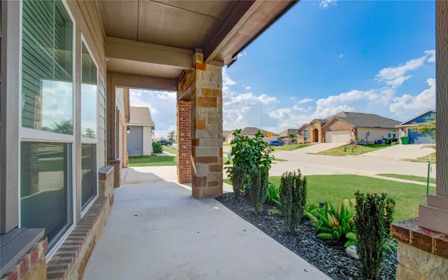 a view of a street with an outdoor seating