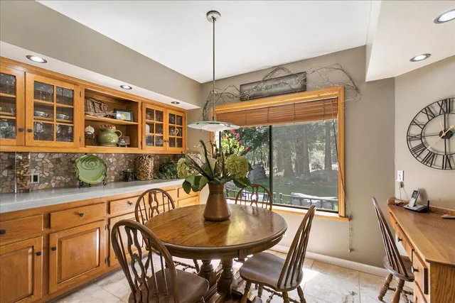 a view of a dining room with furniture window and outside view