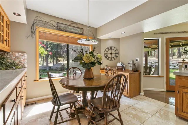 a dining room with furniture and window