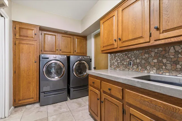 a kitchen with stainless steel appliances granite countertop a sink and cabinets