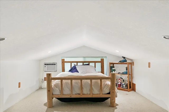 a bedroom with furniture and a window