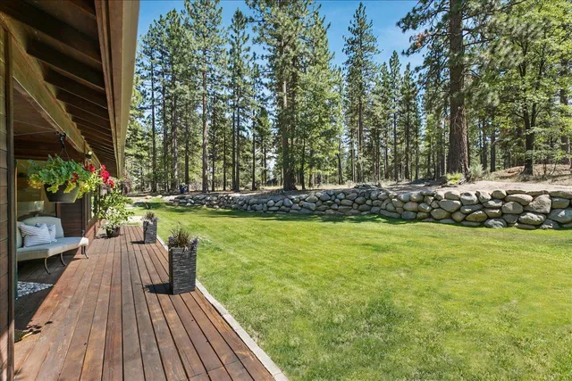 a view of a chairs and table on the wooden deck