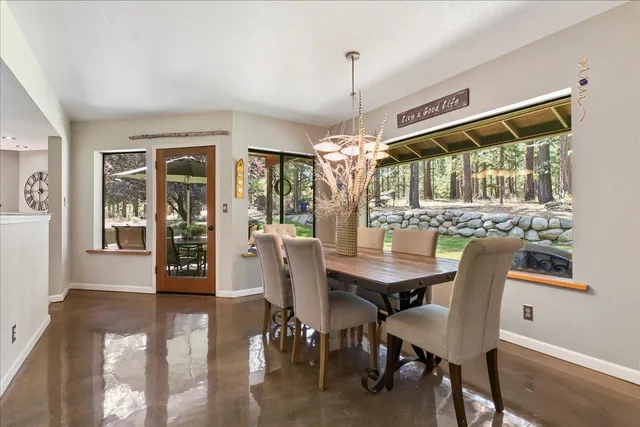 a view of a dining room with furniture window and outside view