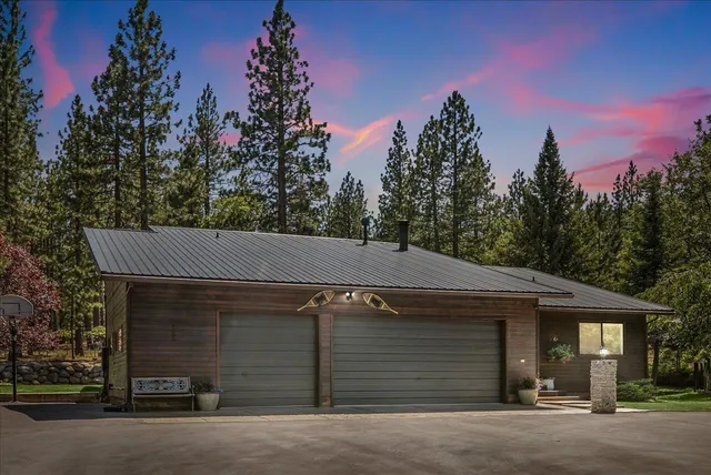 a view of a house with a yard and garage