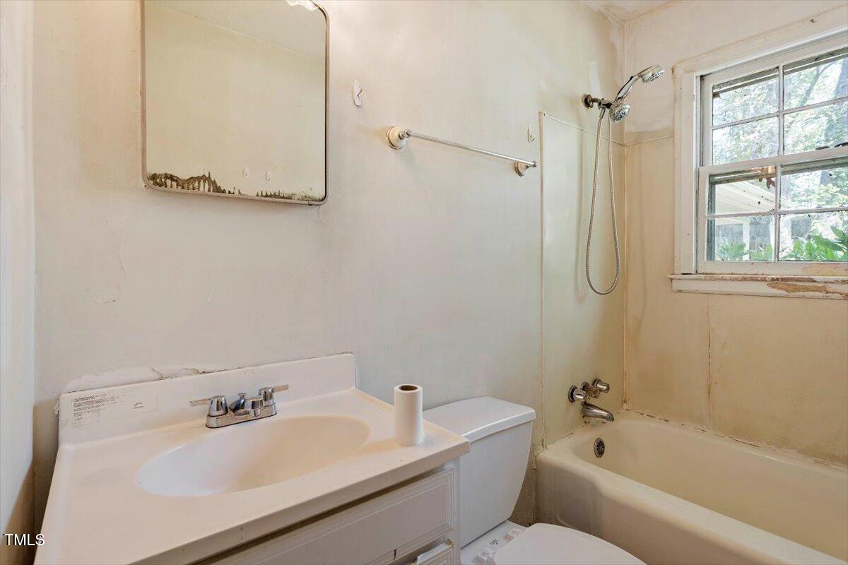 2343 Derby Drive Raleigh, NC 27610 - Photo 17 of 28 a bathroom with a sink mirror toilet and bathtub
