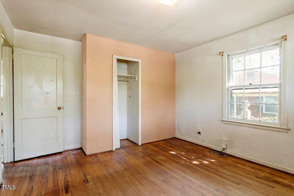 2343 Derby Drive Raleigh, NC 27610 - Photo 19 of 28 a view of empty room with wooden floor and fan