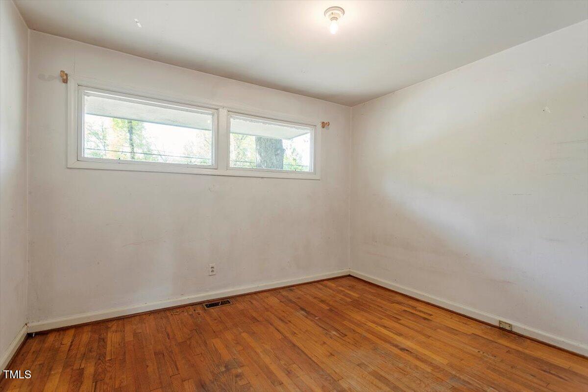 2343 Derby Drive Raleigh, NC 27610 - Photo 20 of 28 wooden floor in an empty room