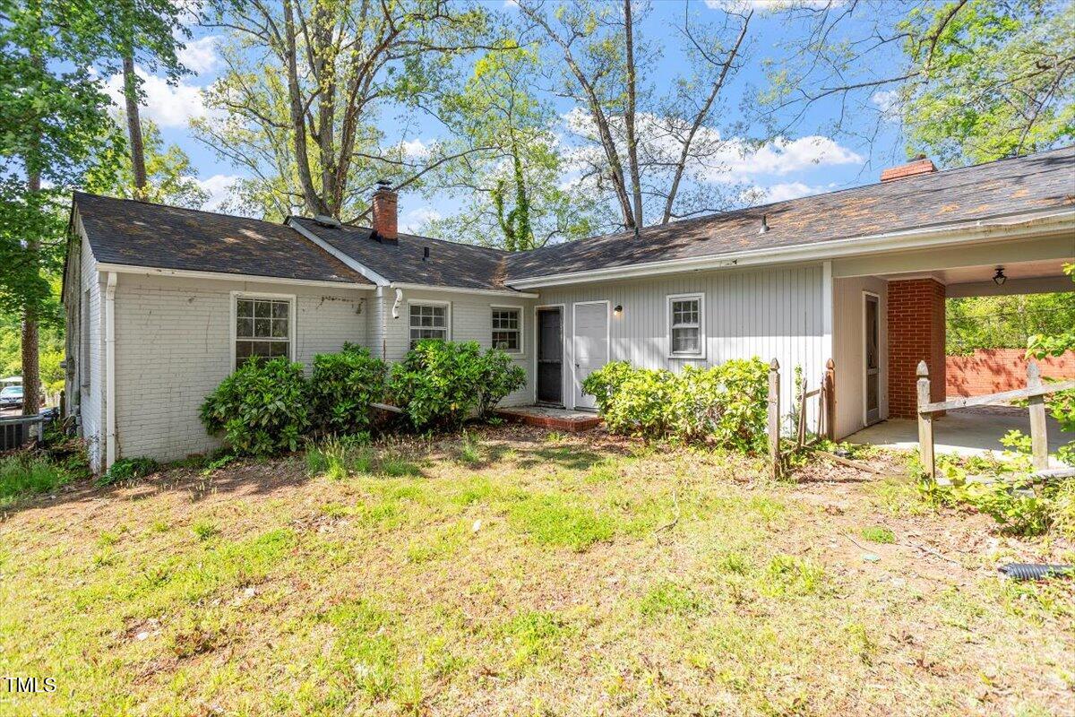 2343 Derby Drive Raleigh, NC 27610 - Photo 22 of 28 a front view of house with yard and trees around
