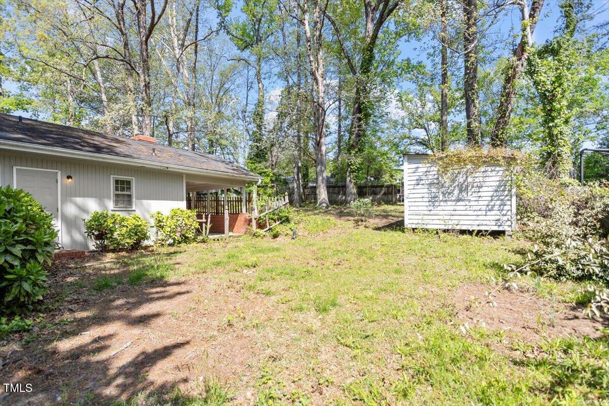 2343 Derby Drive Raleigh, NC 27610 - Photo 23 of 28 a backyard of a house with yard and outdoor seating