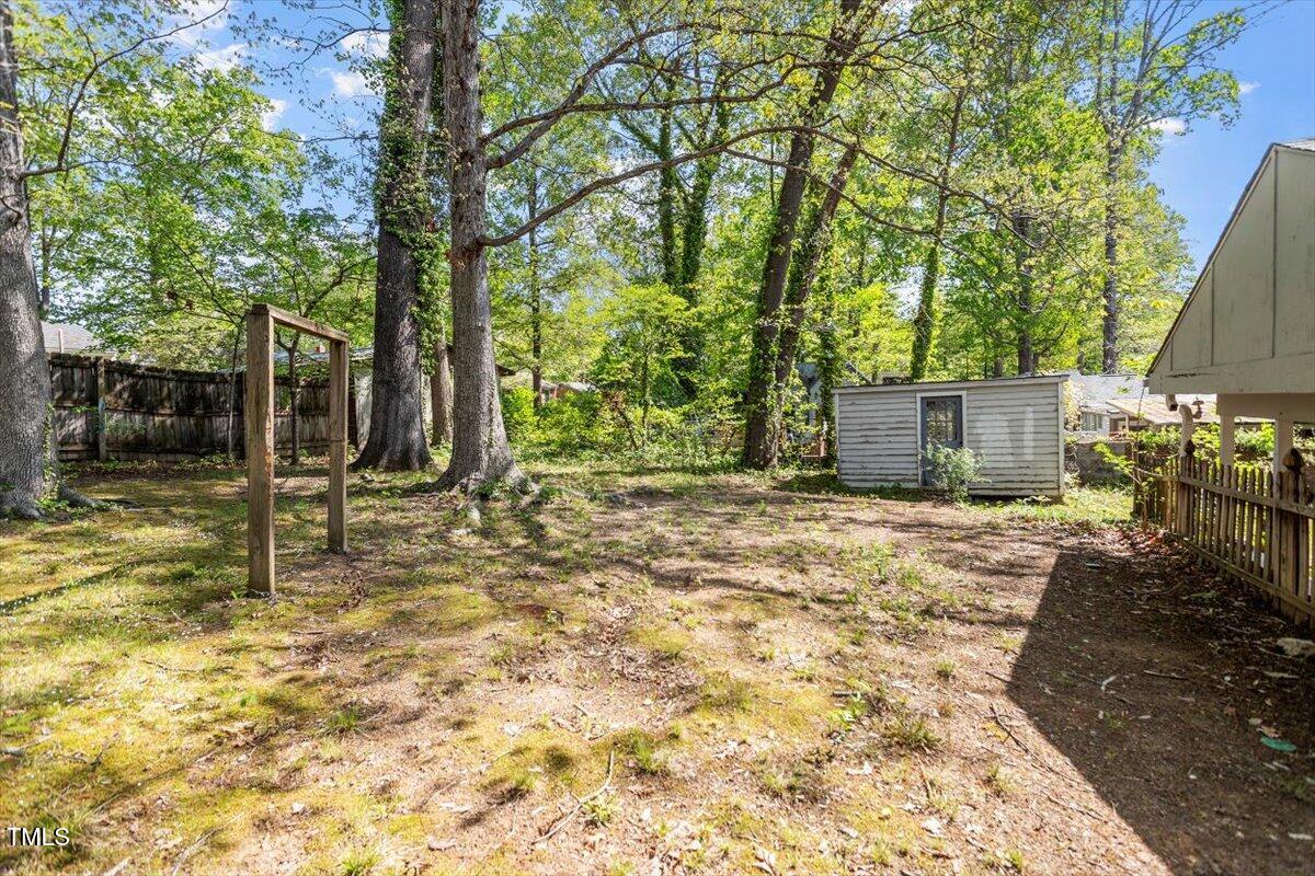 2343 Derby Drive Raleigh, NC 27610 - Photo 25 of 28 a view of a backyard with large trees