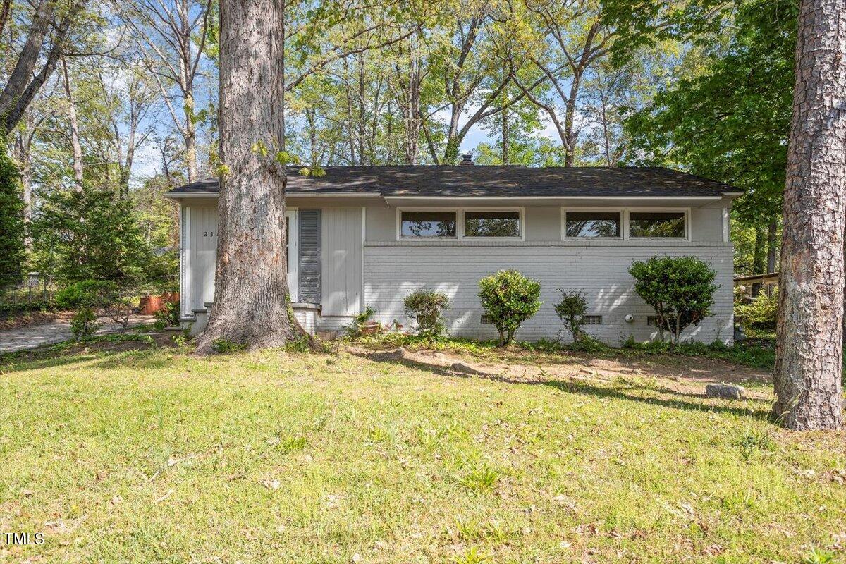 2343 Derby Drive Raleigh, NC 27610 - Photo 26 of 28 a front view of a house with a yard