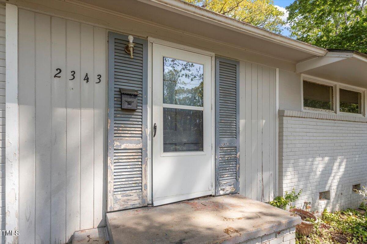 2343 Derby Drive Raleigh, NC 27610 - Photo 2 of 28 a view of a porch with a table and chair